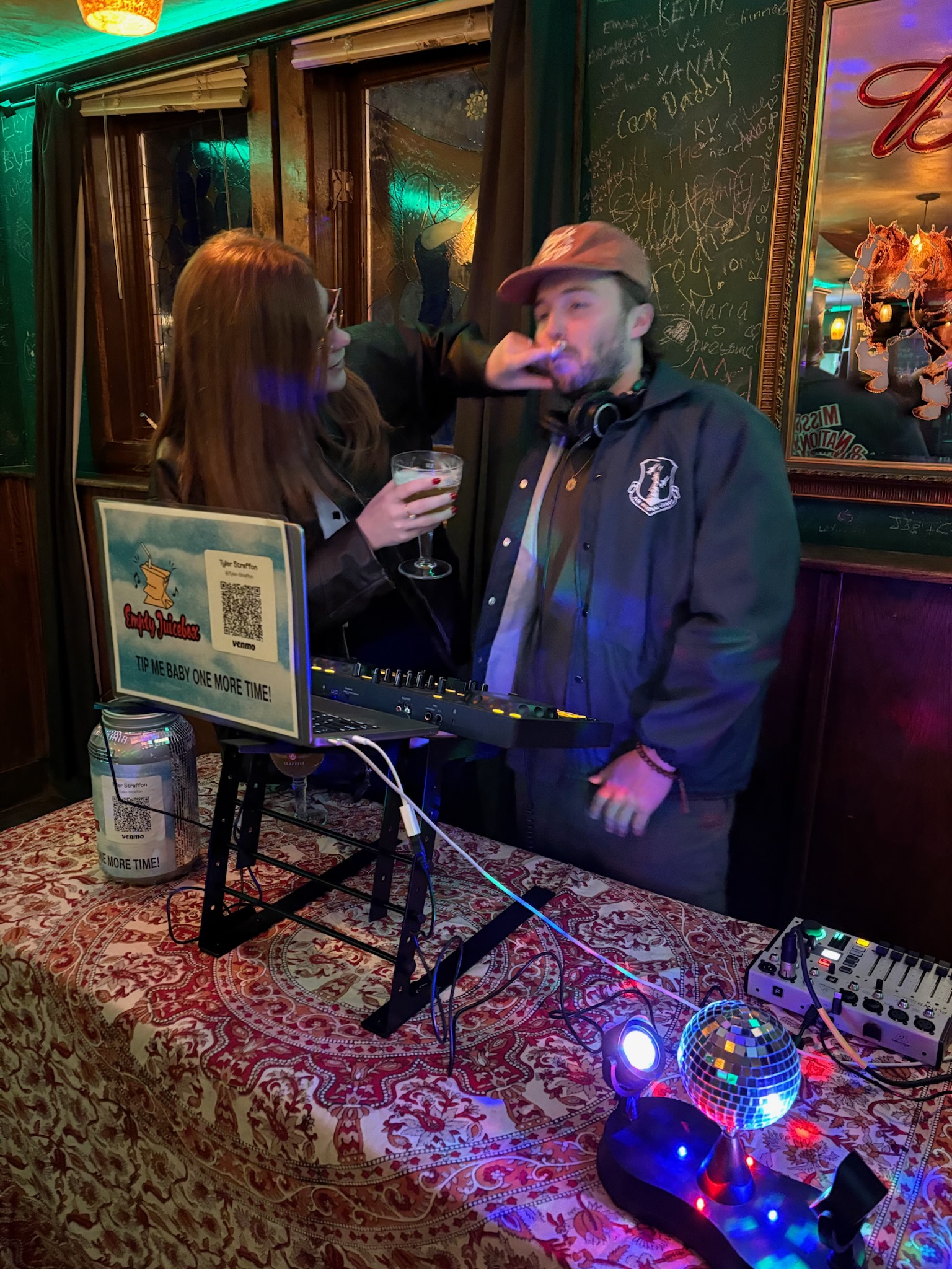Tyler spinning tunes at a bar